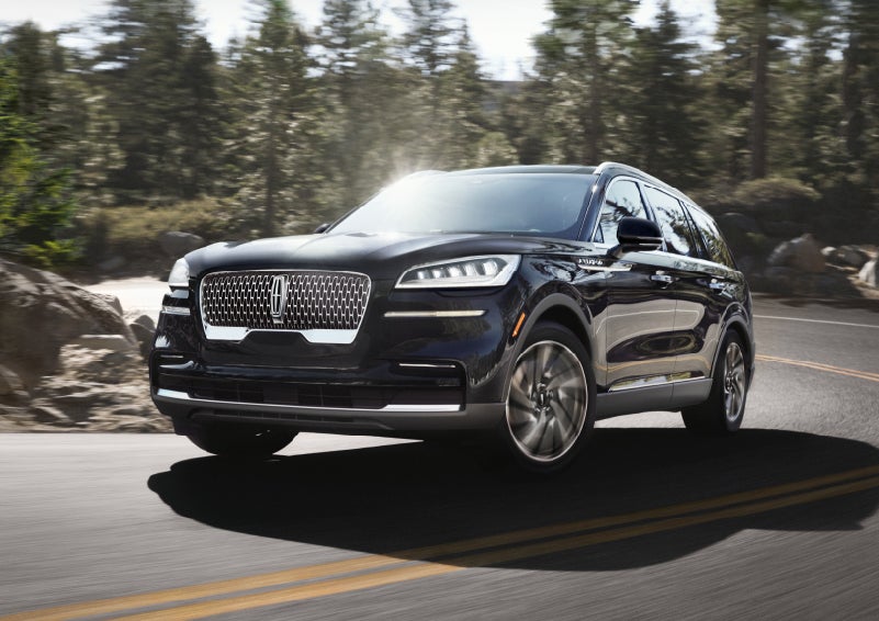 A Lincoln Aviator® SUV is being driven on a winding mountain road | Bozard Lincoln in Saint Augustine FL