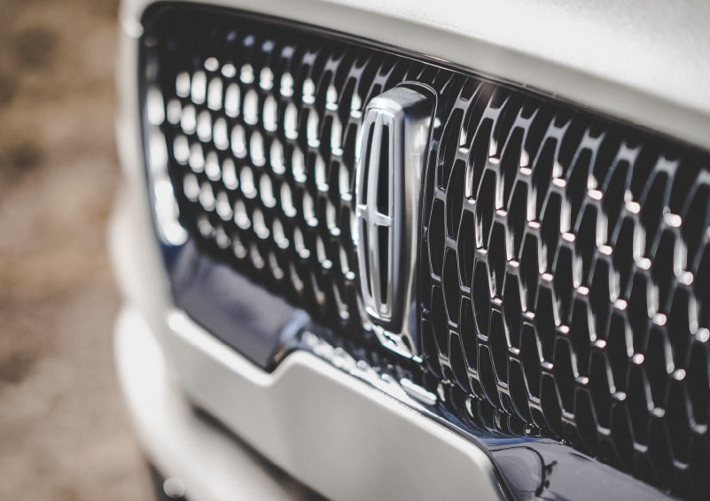 The grille of the 2024 Lincoln Aviator® Reserve model with an eye-catching repeated field of Lincoln Star logo shapes | Bozard Lincoln in Saint Augustine FL